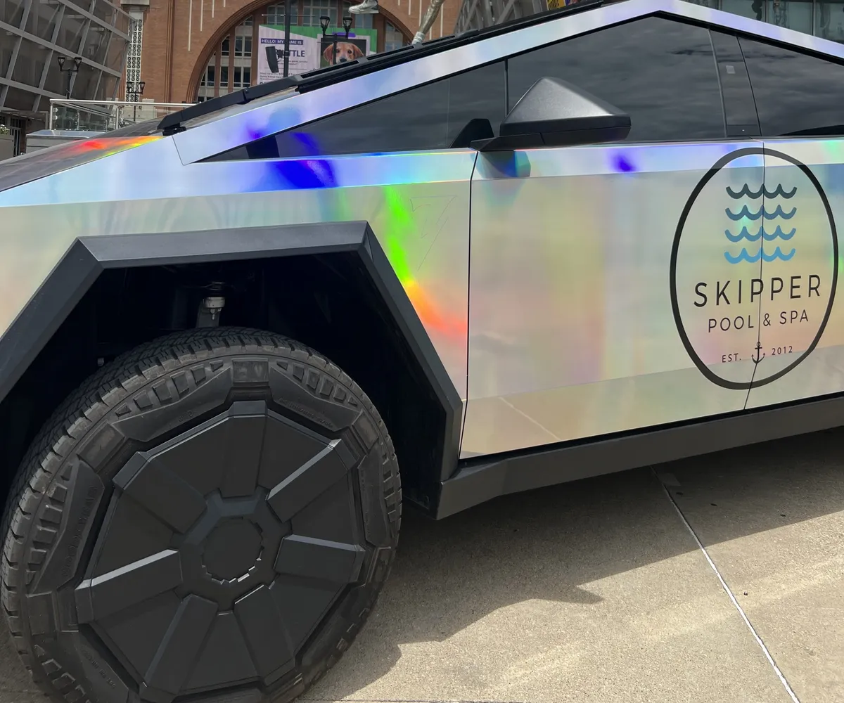 Holographic Skipper Cybertruck on an arena plaza