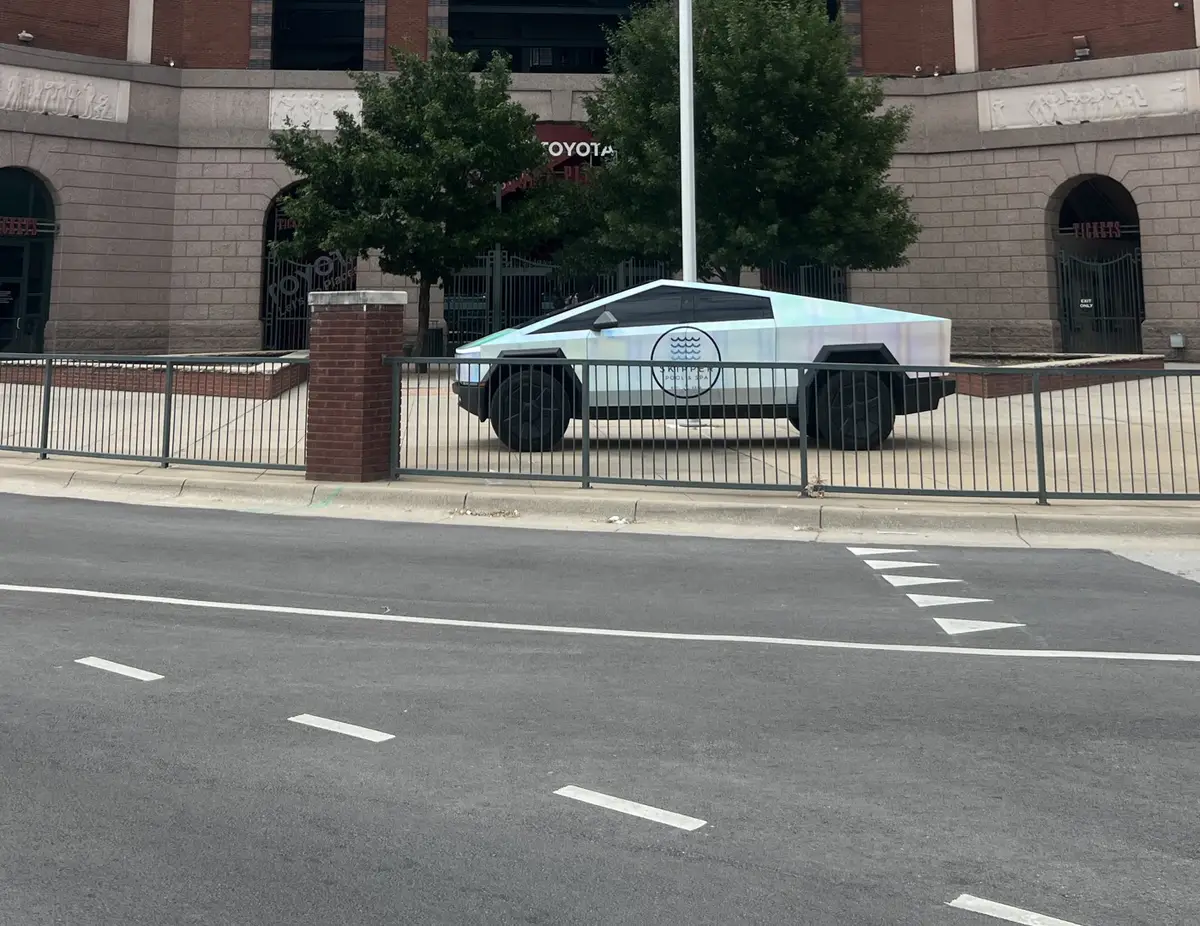 Skipper Cybertruck parked in front of a ballpark