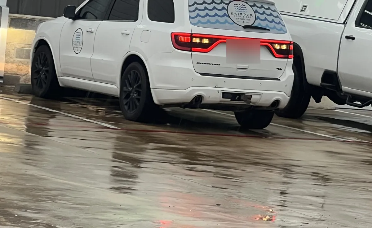 White Skipper Durango with logo on the rear glass