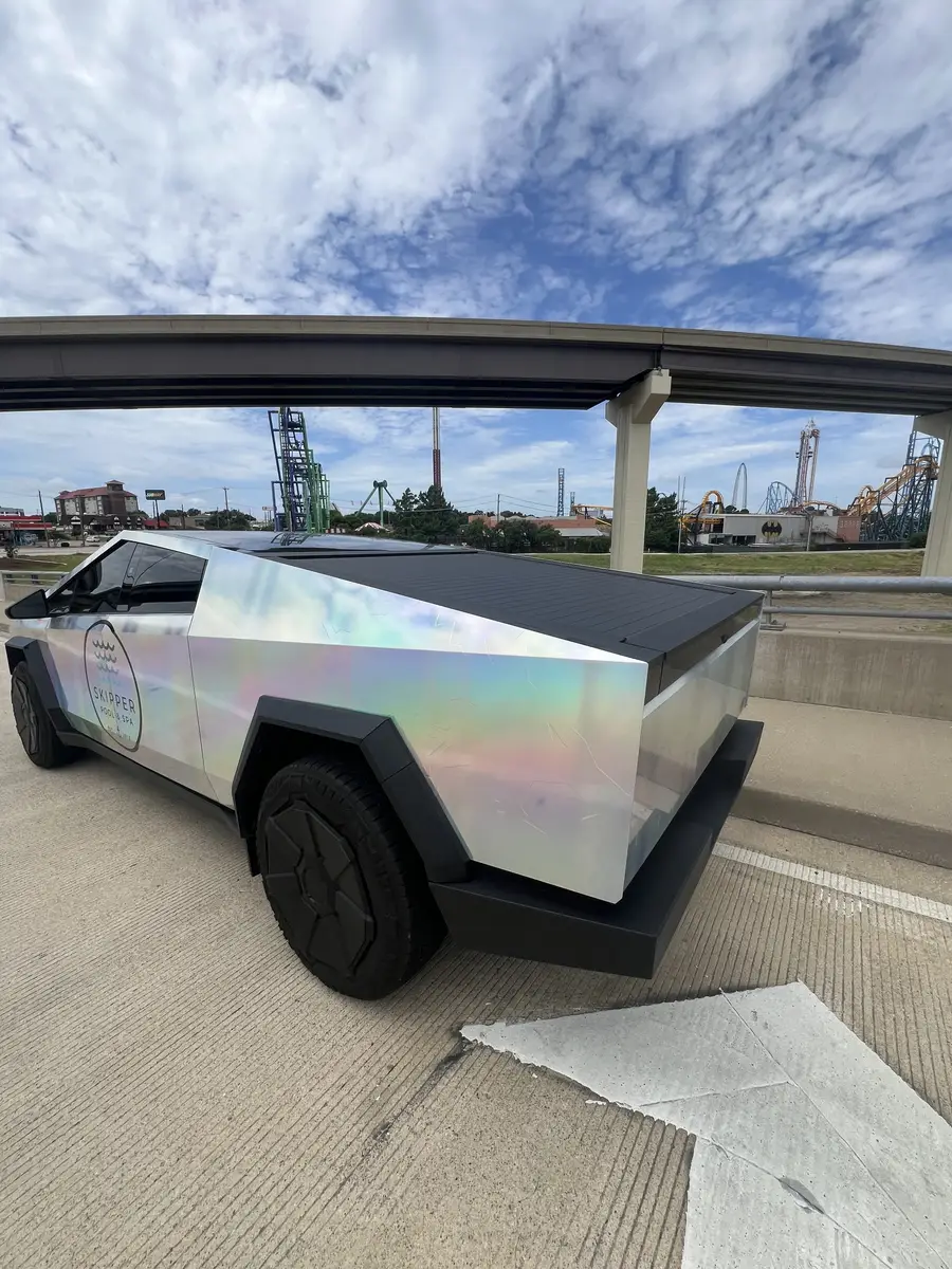 Skipper Cybertruck parked under a highway overpass