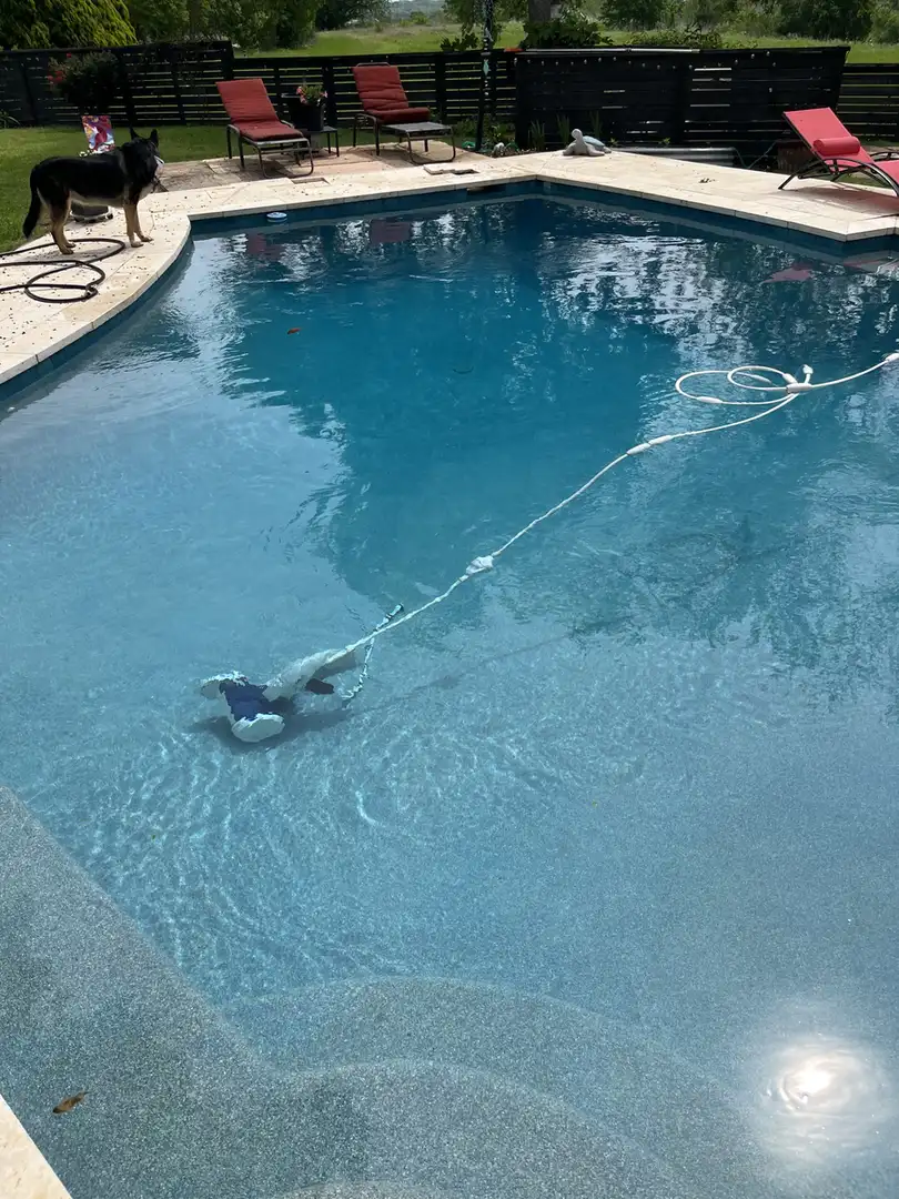 Clear pool with a cleaner running