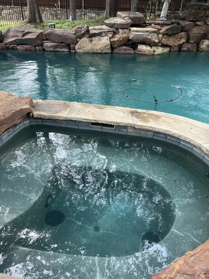 Clear spa next to the pool