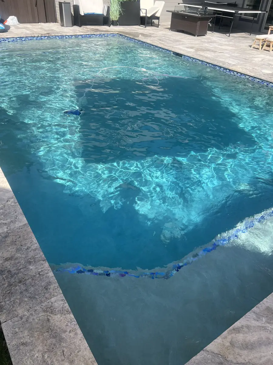 Clear rectangular pool with tile border