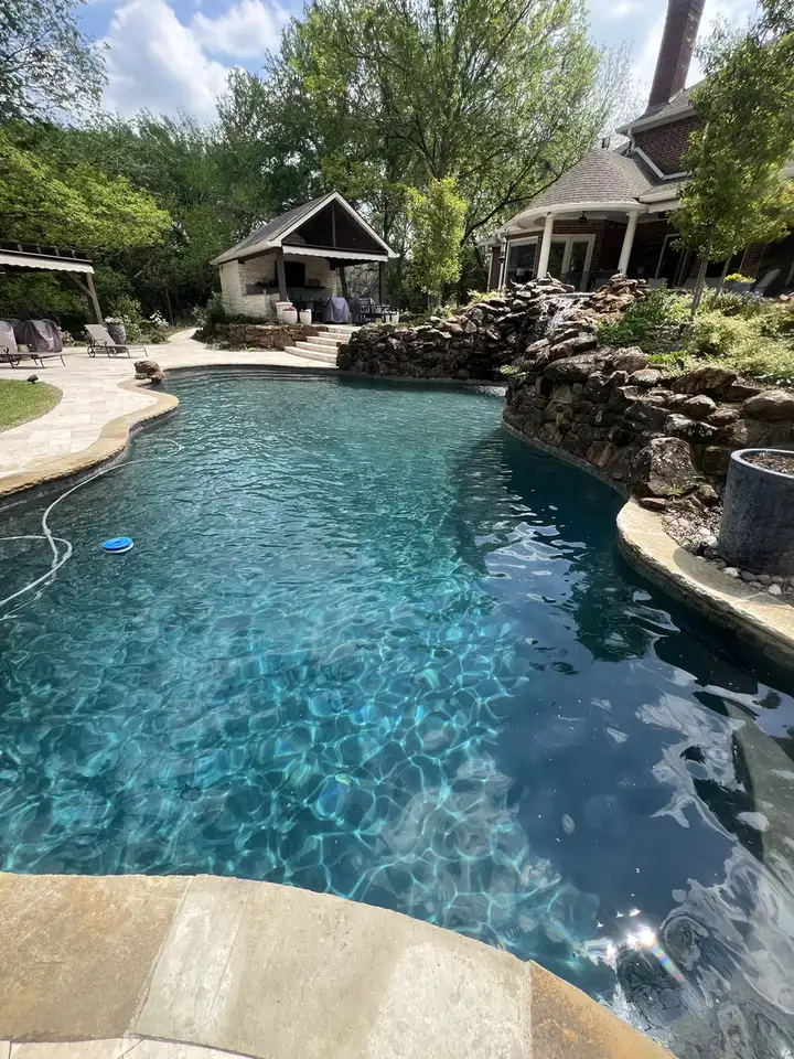Freeform pool with rock waterfall
