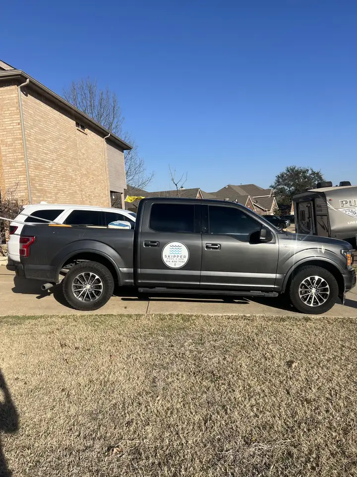 Gray Skipper F-150 work truck, side profile