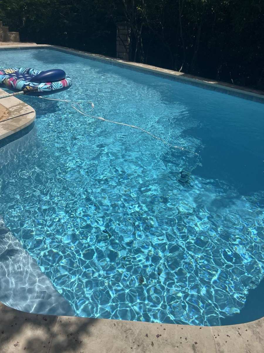 Clear turquoise residential pool with tropical float