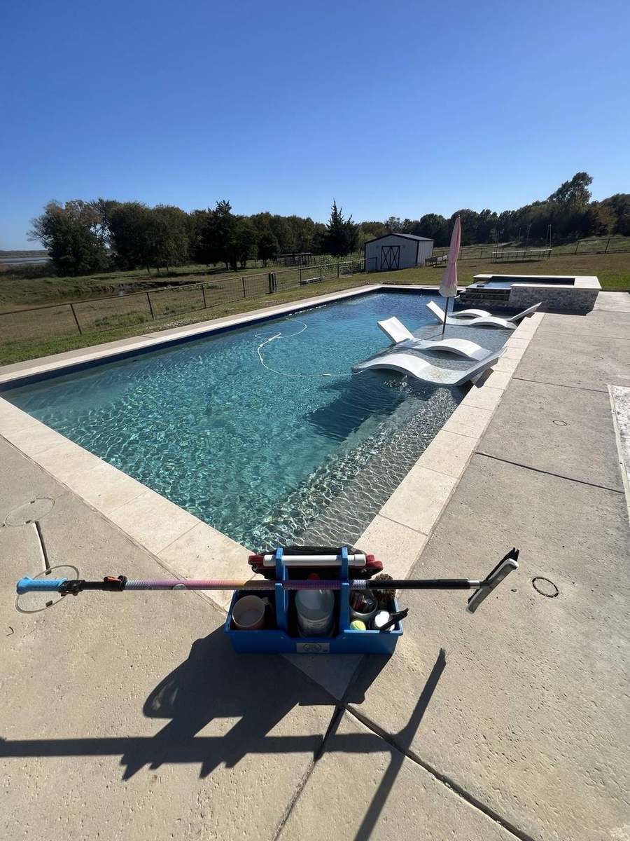 Clear lakeview pool with service caddy on the deck