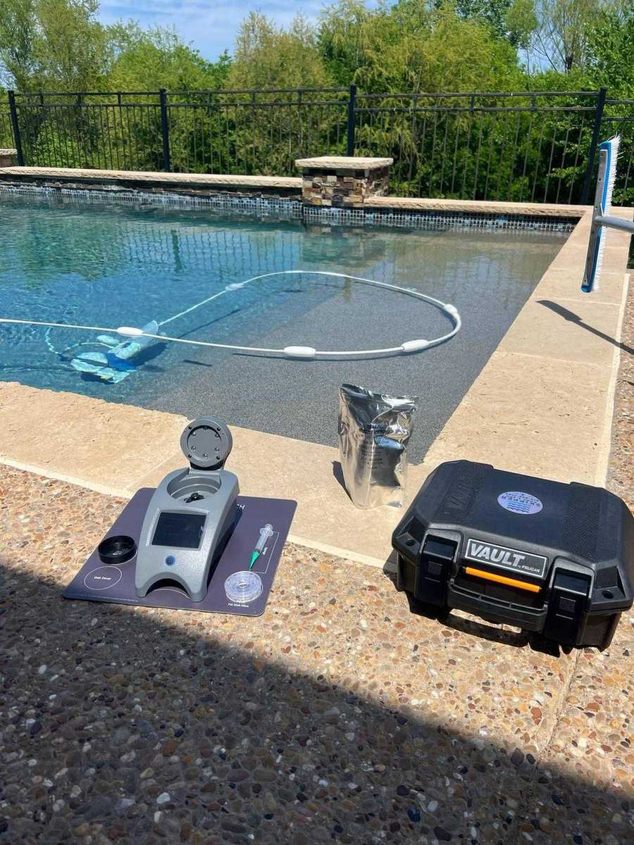 WaterLink SpinTouch water testing kit and Skipper hard case on pool deck