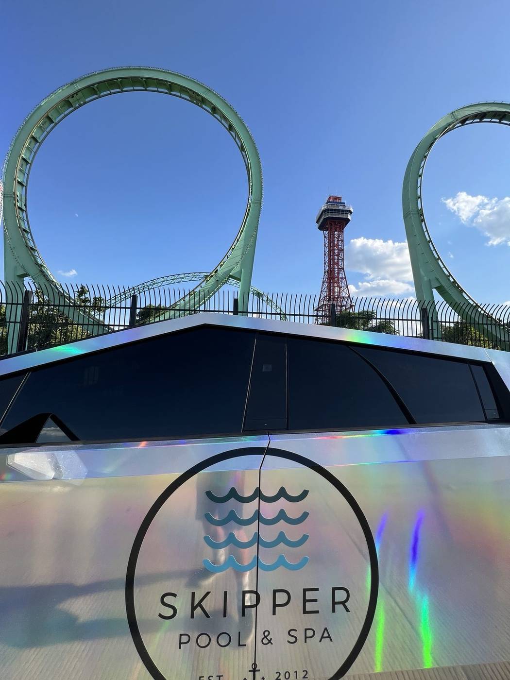 Skipper Pool & Spa logo on holographic Cybertruck door