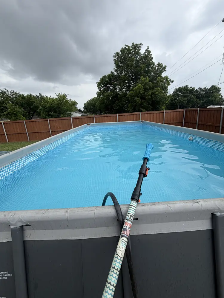 Custom Skipper x Primate pole resting on the rim of a clear blue pool